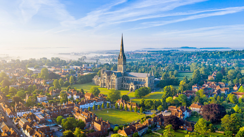 Aerial view of Salisbury and Salisbury Cathedral on a misty summer morning, England