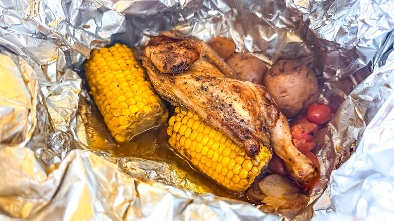Chicken and vegetables cooked in foil