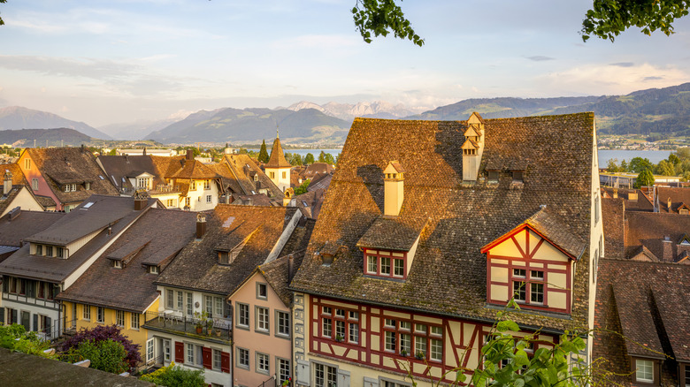 Old Swiss apartment homes at sunset