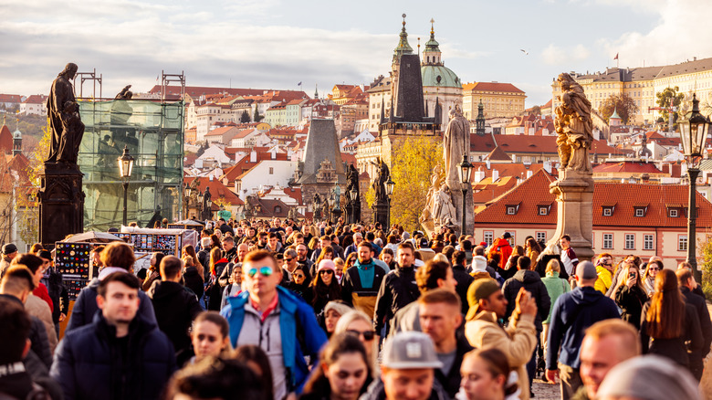 Tourists swarming Charles Bridge in Prague