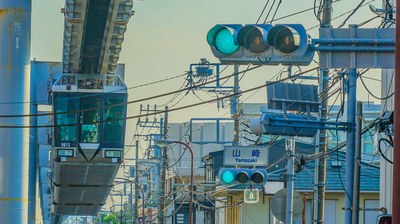 Traffic lights in Japan displaying green lights