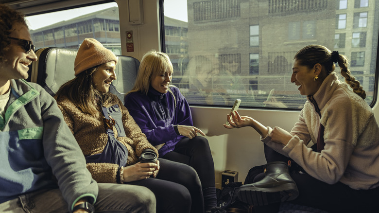 Travelers talking on a train