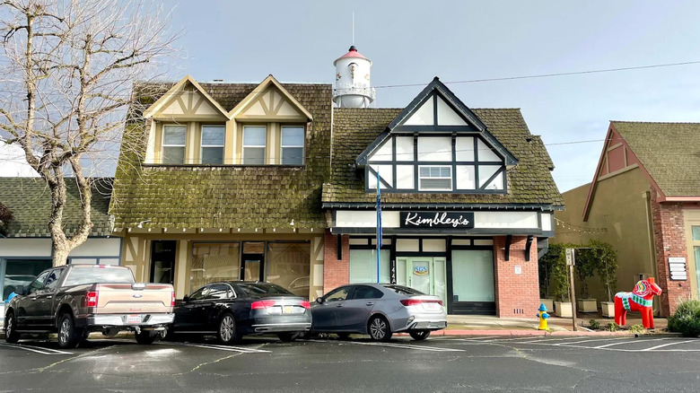 Cars parked in front of small, Swedish-inspired storefronts in Kingsburg, California