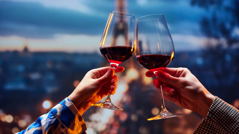 Couple toasting glasses of wine