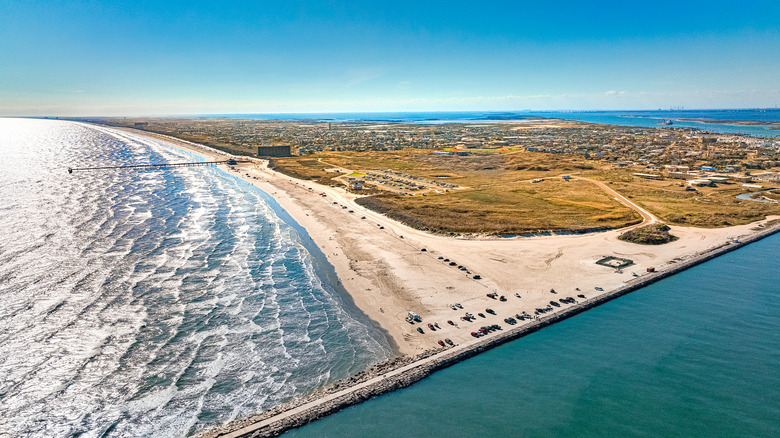 Aerial of Port Aransas' sea wall, beach, and waves