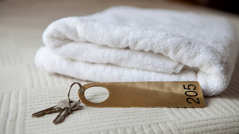 A towel and hotel room keys