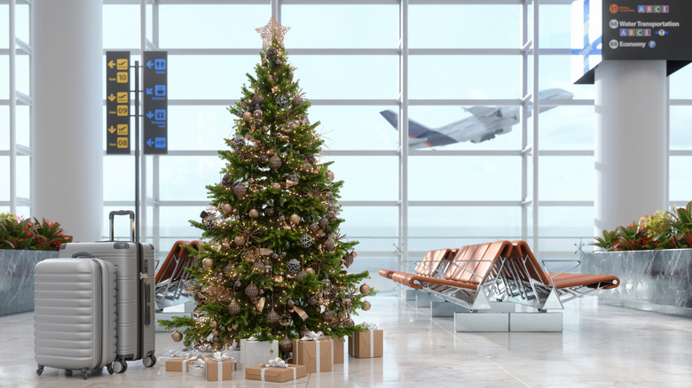 Christmas tree adorns an airport waiting area