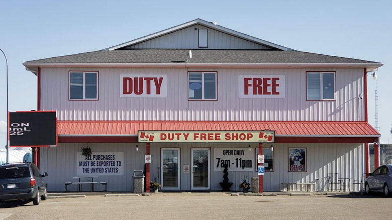 Exterior of a duty free store in Coutts, Alberta with blue sky visible.