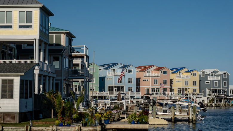 Colorful houses with boats docked right in front along the marina in Selbyville