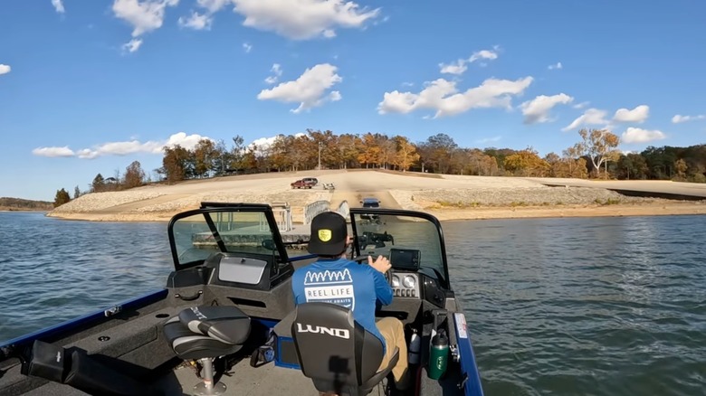 An angler steering his boat back to the ramp at Clearwater Lake, Missouri