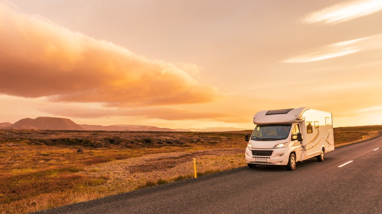 RV driving at sunrise