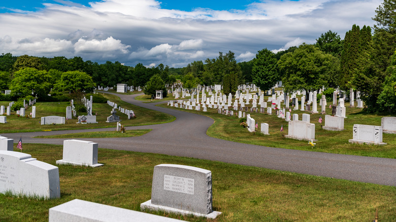 Gravestones under blue sky at Hope Cemetery in Barre, Vermont