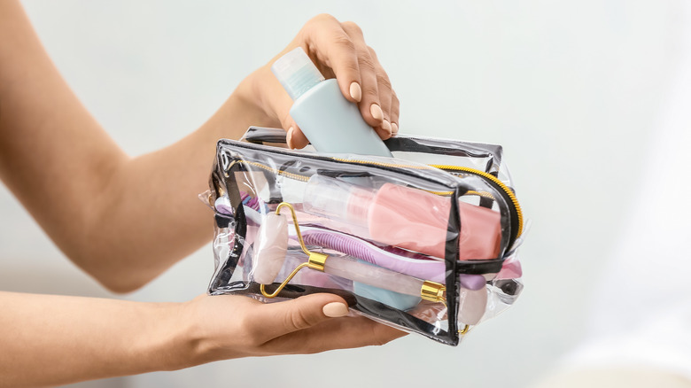 Hands hold travel bag