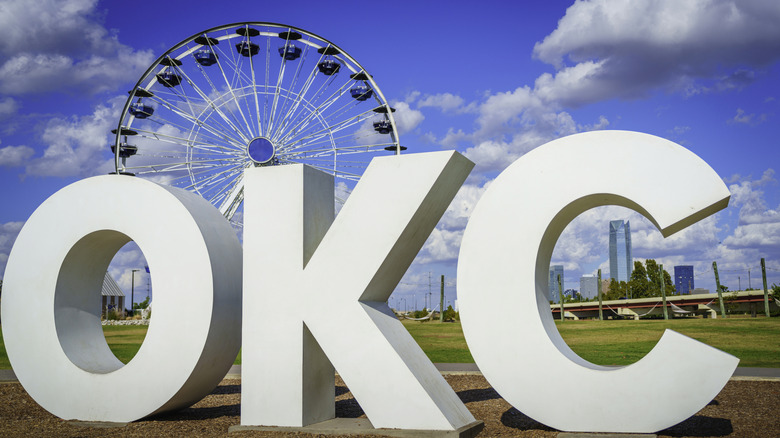 OKC city lettering against the ferris wheel