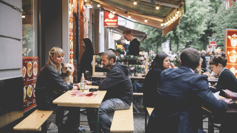 Patrons dining outside Berlin restaurant