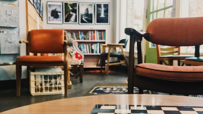 Two brown chairs in bright River City Coffee