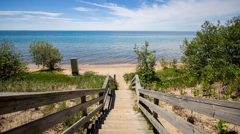Boardwalk to sandy beach in Manistique, Michigan.