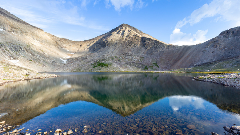 Mountains rise around the shimmering waters of Goat Lake, Idaho