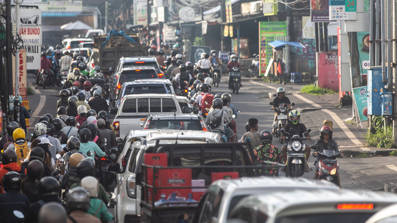 People traveling through rush hour traffic in Canggu, Bali
