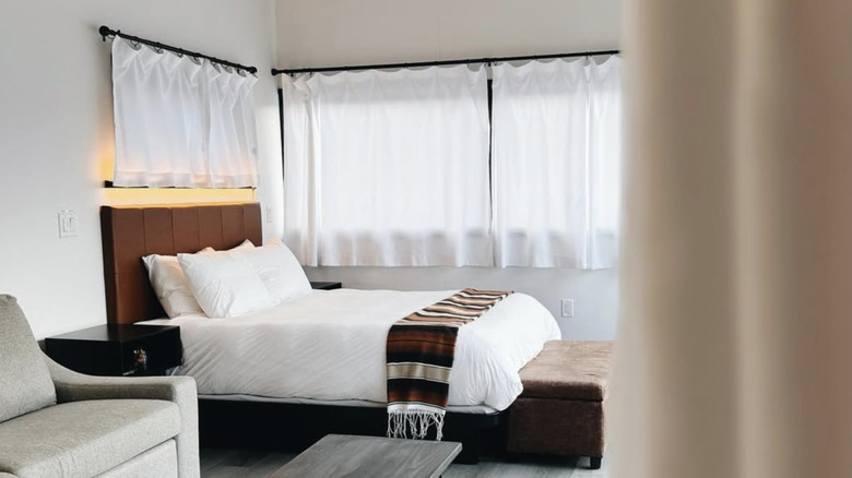 Interior of a room at Ofland with view of bed and windows