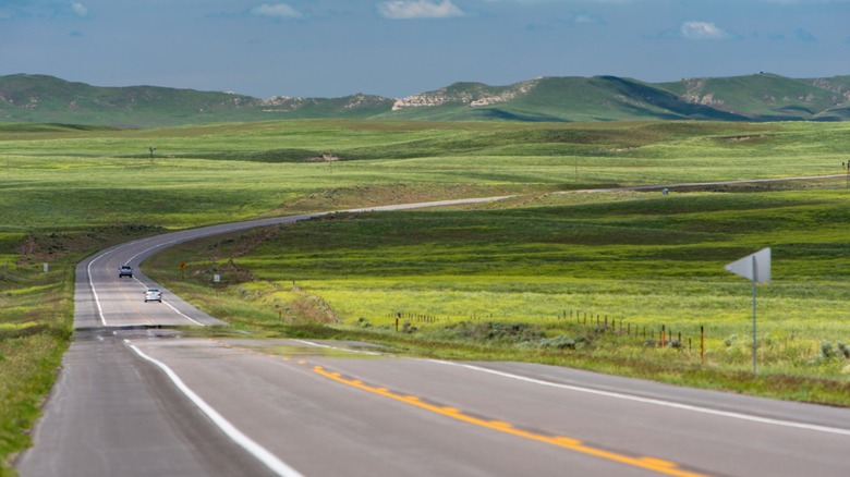 A road with lush rolling hills in Nebraska