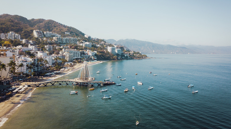 Sunny coast of Mexico with boats in the harbor
