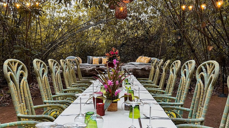 Dinner setup under the trees at Shinta Mani Wild