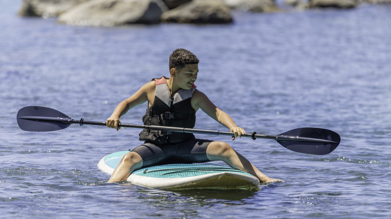Teen paddleboarding at Lake Tahoe