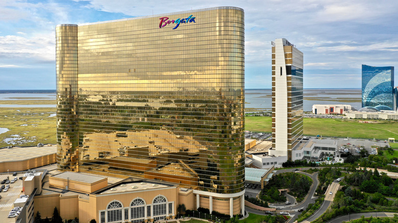 An aerial view of the Borgata hotel and casino in glowing yellow sunlight in Atlantic City