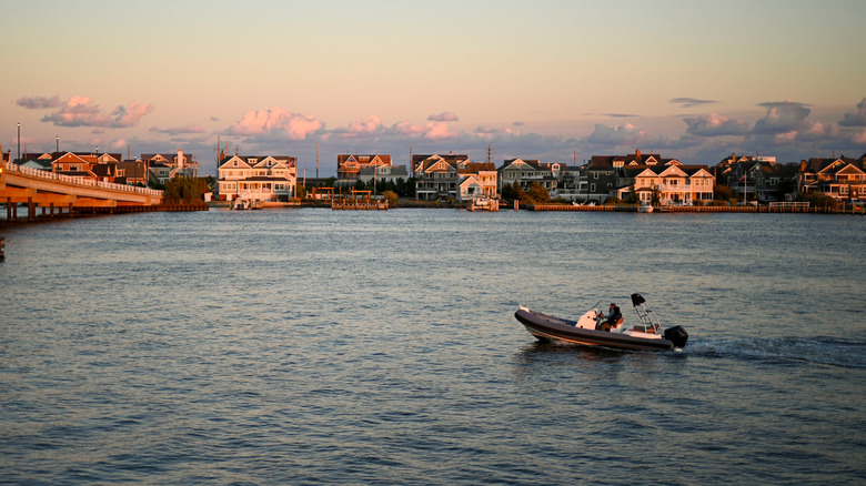 A small boat sailing in front of Toms River, New Jersey