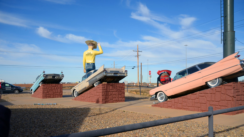 Giant cowboy and vintage cars at Cadillac Ranch