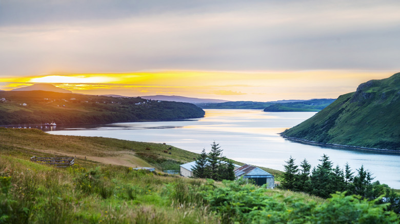 Sun sets over the wide waters and hilly banks of Loch Morar