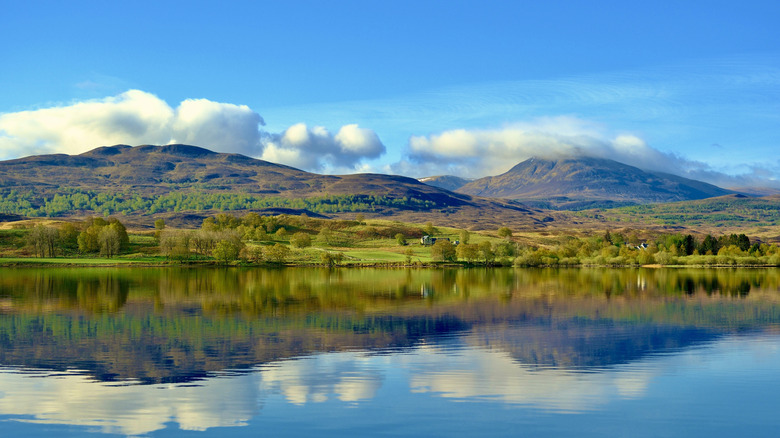 The hills around Loch Rannoch are reflected in the lake's waters