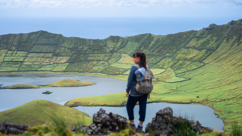 Person overlooking the stunning Caldeirão on Corvo, Azores archipelago