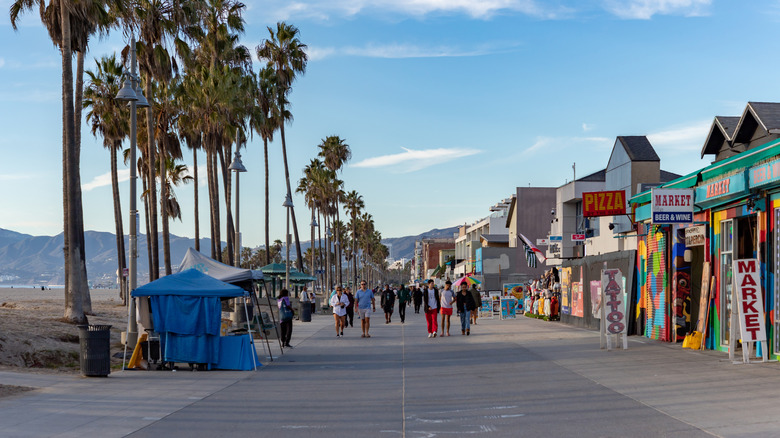 People walking along Venice Beach Boardwalk