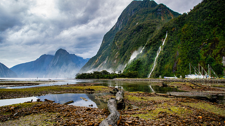 Waterfall and Mitre peak views on an overcast day at Milford Sound