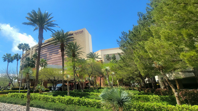 Exterior view of Red Rock Casino Resort & Spa with leafy trees