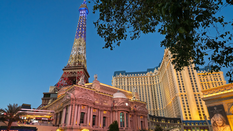 The replica Eiffel Tower and main building of Paris Las Vegas Hotel and Casino are seen illuminated along the Las Vegas Strip during the evening