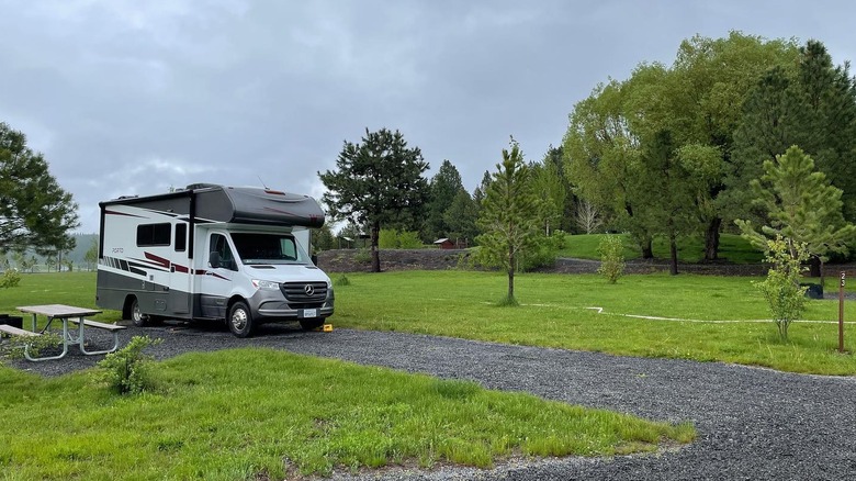 An RV parked at the grassy campground at Bates State Park, Oregon