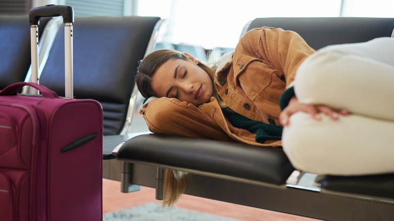 Woman asleep in an airport