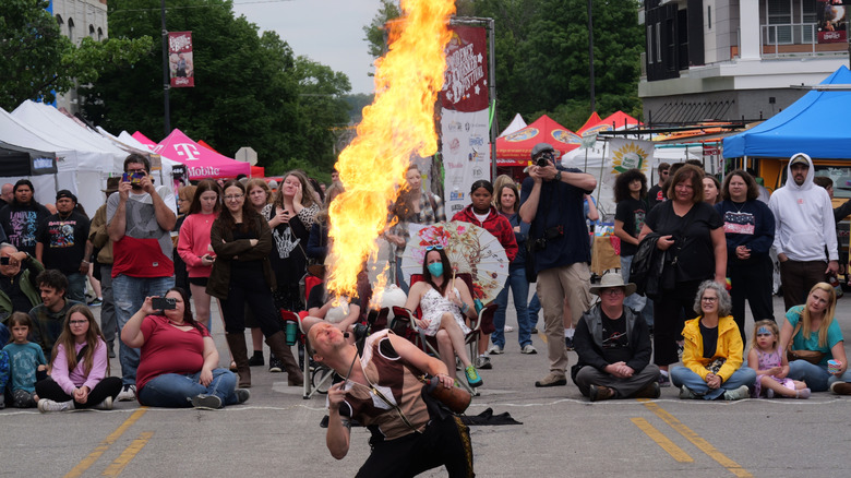 A street performer at the annual Lawrence Busker Festival, Lawrence, Kansas