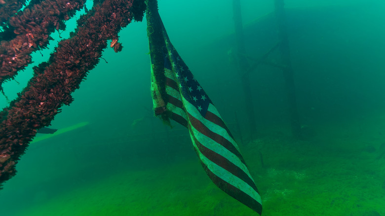 An American flag underwater in a Midwest quarry dive site