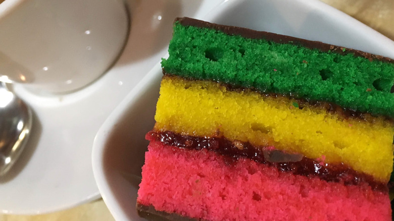 A cake is layered in the colors of the Italian flag