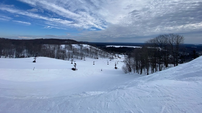 Crystal Mountain lit up for night skiing with the facilities at the bottom of the hill