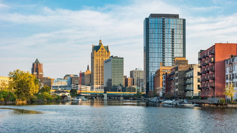 Downtown Milwaukee's Third Ward and lakefront, with large buildings around blue water with boats and trees