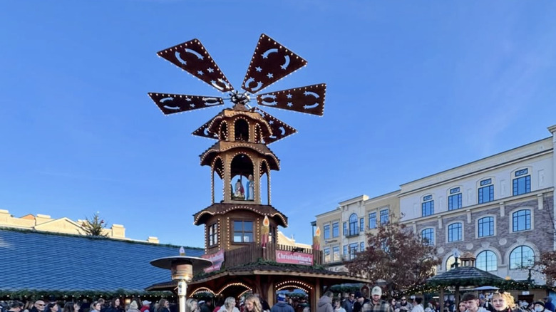 the main centerpiece — a sculpture with a fan top — on a sunny day