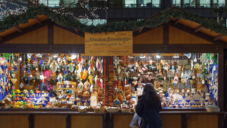 A woman shops at a stall at Chicago's Christkindlmarkt
