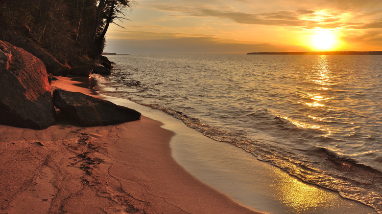 A sandy lake beach at sunset on Wisconsin's Apostle Islands