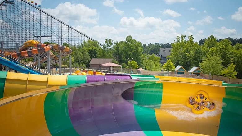 Four people going fast on a water slide at Holiday World and Splashin' Safari.
