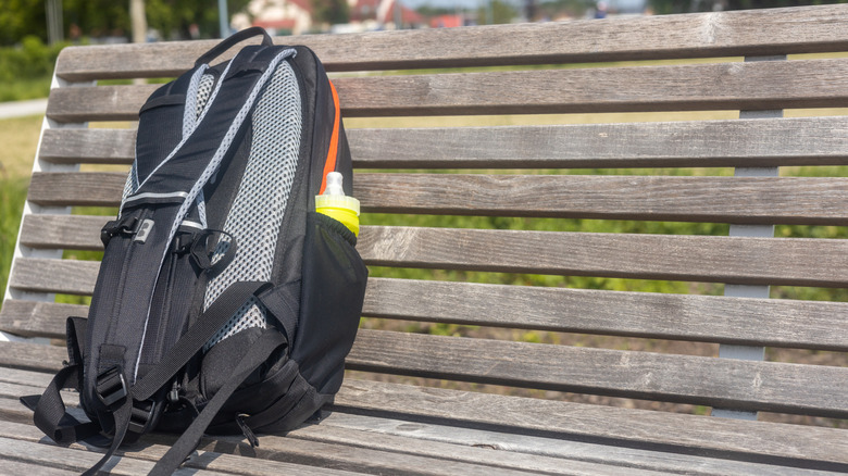 A backpack left on a bench in public